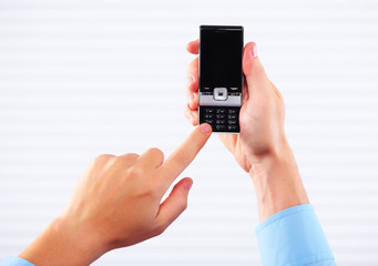 Hands of woman with a smartphone.