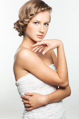 Fototapeta premium Portrait of young woman with braid hairdo