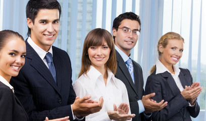 Cheerful business people applauding