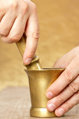Close up of man hands with mortar and pestle