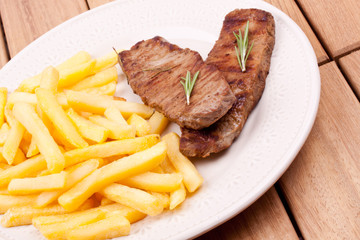 grilled steak with french fries