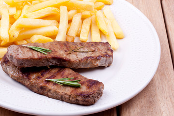 grilled steak with french fries
