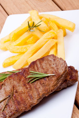 grilled steak with french fries