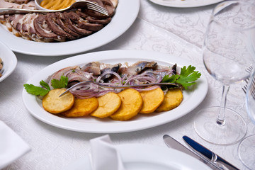 dish with a potato and fish