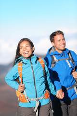 Happy interracial couple hiking