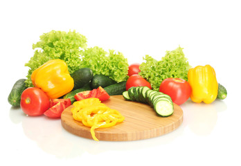 fresh vegetables on cutting board isolated on white
