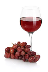 glass of wine and ripe grapes isolated on white