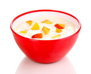 Yoghurt with peach in bowl isolated on white
