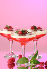 fruit jelly with berries in glasses on pink background