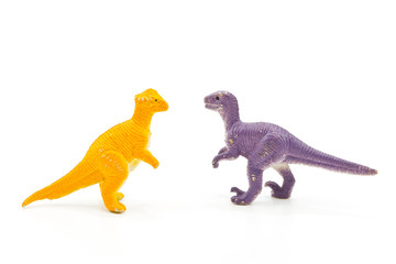 Toy plastic dinosaur on white baclground