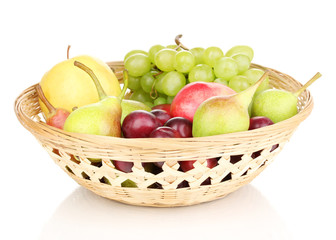 Mix of ripe sweet fruits and berries in basket isolated on