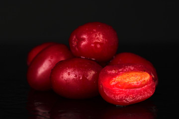 fresh cornel berries isolated on black