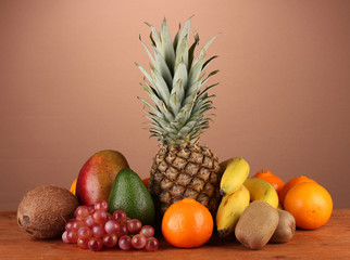 still life of fruit on a table on a brown background