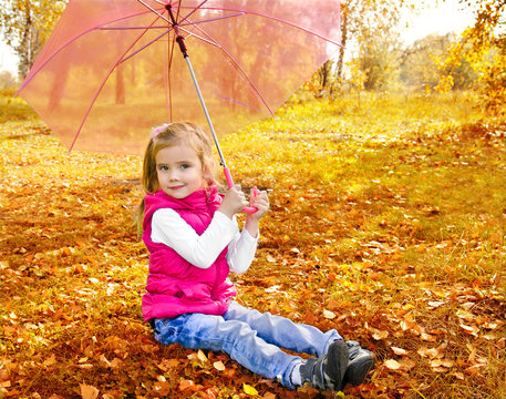 Portrait of cute little girl with umbrella