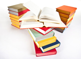 Many multicolored stacked books