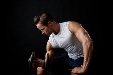 Male doing dumbbelll lifts