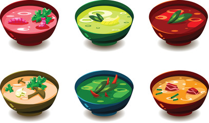 Set of various tasty soups in colorful bowls