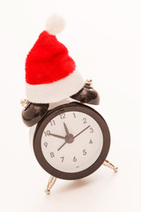 alarm clock with christmas santa hat on