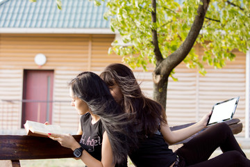 Women relaxing on a garden bench