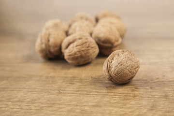 Walnuts on brown wood