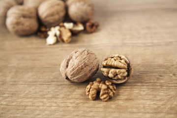 Walnuts on brown wood