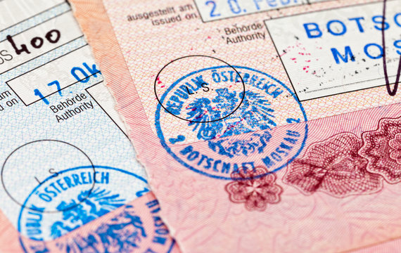 Visa entry and exit stamps in passport