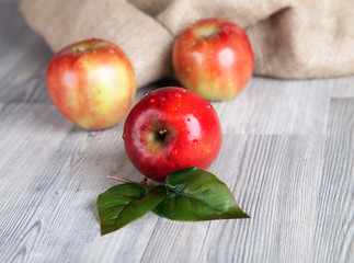 Fresh apples on wooden table 