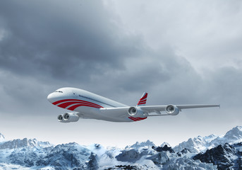 Naklejka na ściany i meble Biały samolot pasażerski nad górami