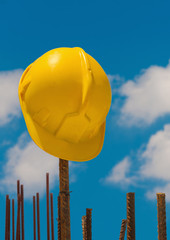 Construction helmet on steel bars