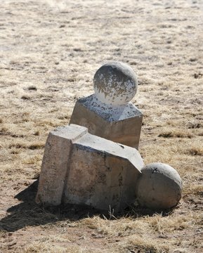 Toppled, fallen tomb stones