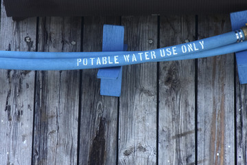 Blue Potable Water Hose on Pier