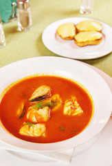 Bouillabaisse - Tomato soup with seafoods in a plate