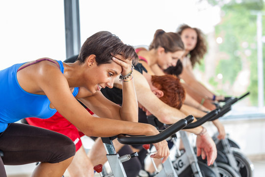 Group of People Cycling at Gym