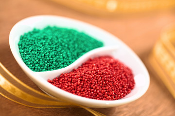 Red and green sugar sprinkles for decorating Christmas cookies