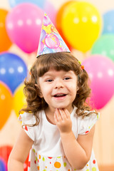 Fototapeta na wymiar joyful kid girl on birthday party
