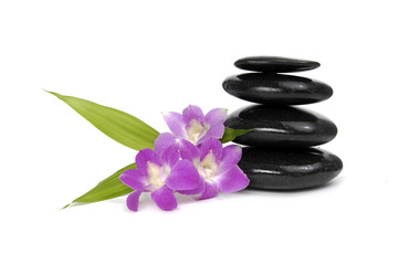 Obraz na płótnie Canvas Zen pebbles balance. Three orchid and bamboo leaf