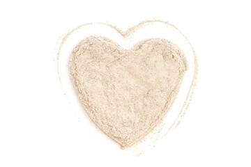 Heap ground White Pepper isolated in heart shape on white backgr