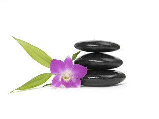 Zen pebbles balance. Three orchid and bamboo leaf