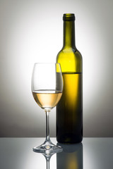 Bottle and glass of white wine