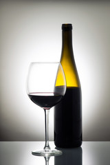 Bottle and glass of red wine