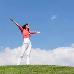 happy young woman dreams to fly on winds