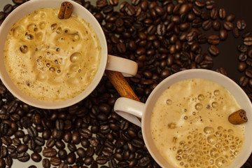 Two cappuccino cups with cinnamon