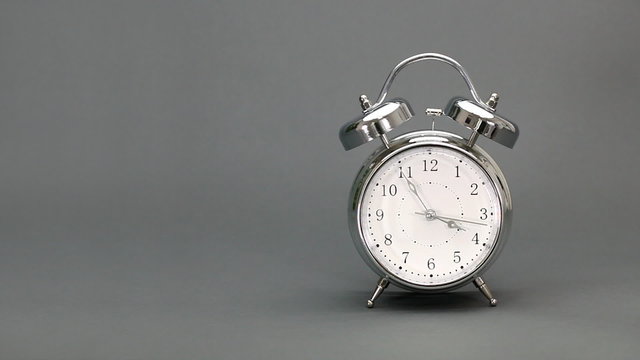 Alarm clock rings just before 12 o'clock