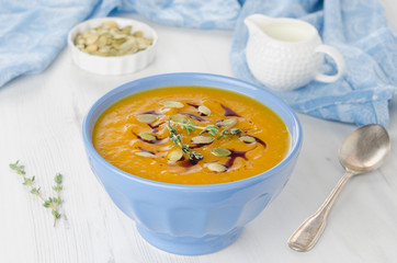 Pumpkin soup with pumpkin oil and seeds