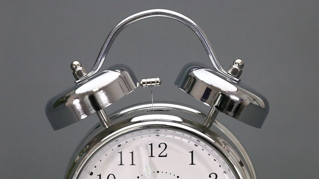 Vintage alarm clock in time lapse