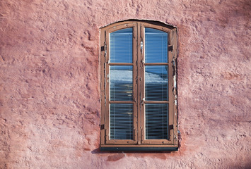 Background texture of old pink wall with window