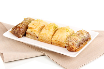 Sweet baklava on plate isolated on white