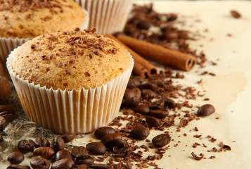 tasty muffin cakes with chocolate, spices and coffee seeds,