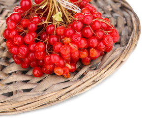 red berries of viburnum on wicker mat close-up