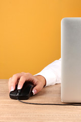 woman's hands pushing keys of pc mouse,